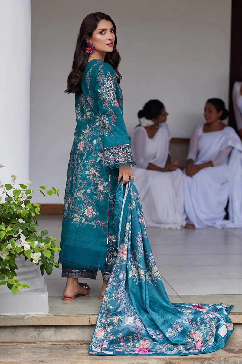 Model wearing Gulaal Saffira Lawn '25 Camila in teal blue with intricate embroidery and digital printed dupatta. Shop Pakistani luxury pret online in the UK.