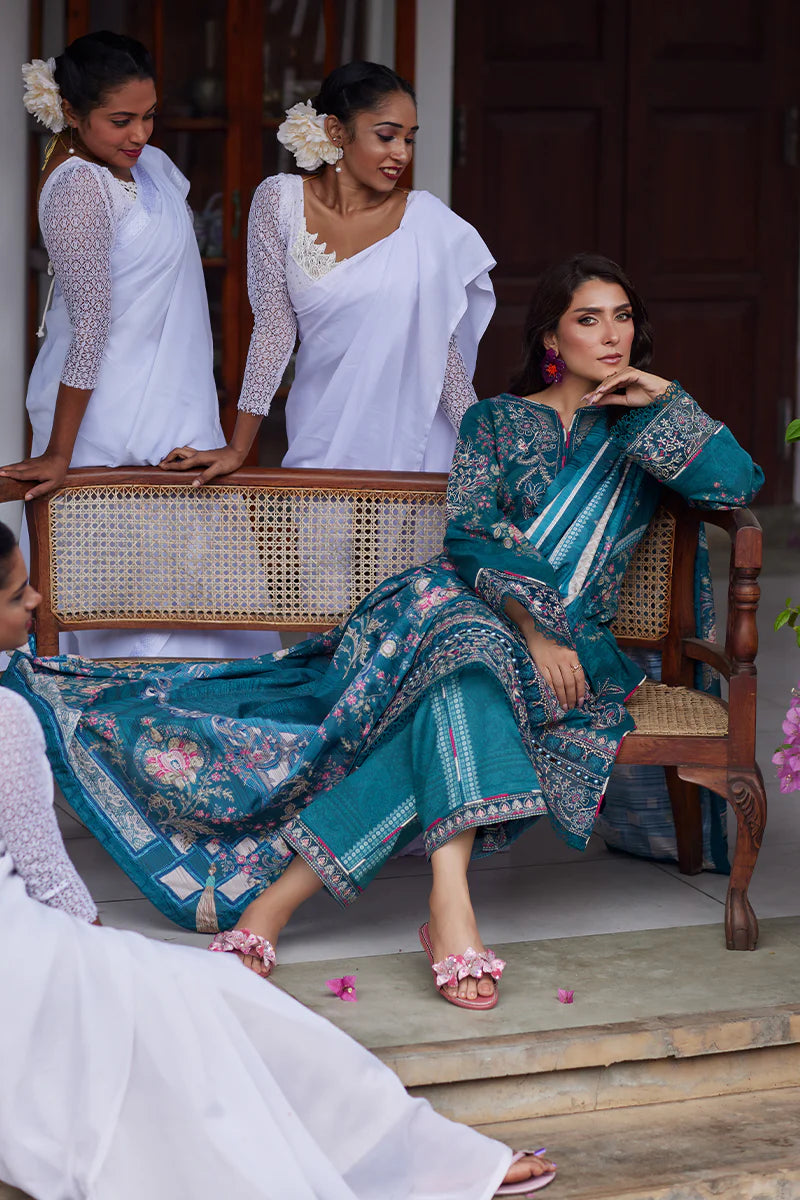 Model wearing Gulaal Saffira Lawn '25 Camila in teal blue with intricate embroidery and digital printed dupatta. Shop Pakistani luxury pret online in the UK.
