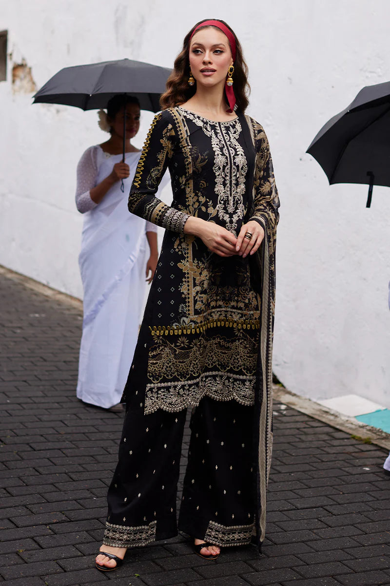Model wearing Gulaal Saffira Lawn '25 Amiri in black with intricate gold embroidery and matching dupatta. Shop Pakistani luxury pret online in the UK.