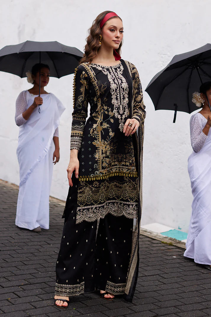 Model wearing Gulaal Saffira Lawn '25 Amiri in black with intricate gold embroidery and matching dupatta. Shop Pakistani luxury pret online in the UK.