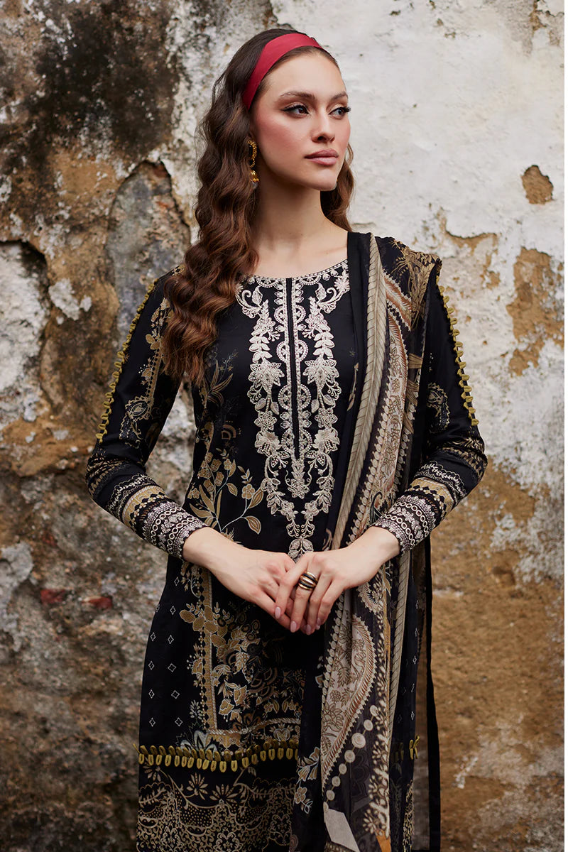 Model wearing Gulaal Saffira Lawn '25 Amiri in black with intricate gold embroidery and matching dupatta. Shop Pakistani luxury pret online in the UK.