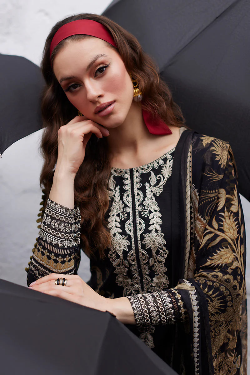 Model wearing Gulaal Saffira Lawn '25 Amiri in black with intricate gold embroidery and matching dupatta. Shop Pakistani luxury pret online in the UK.