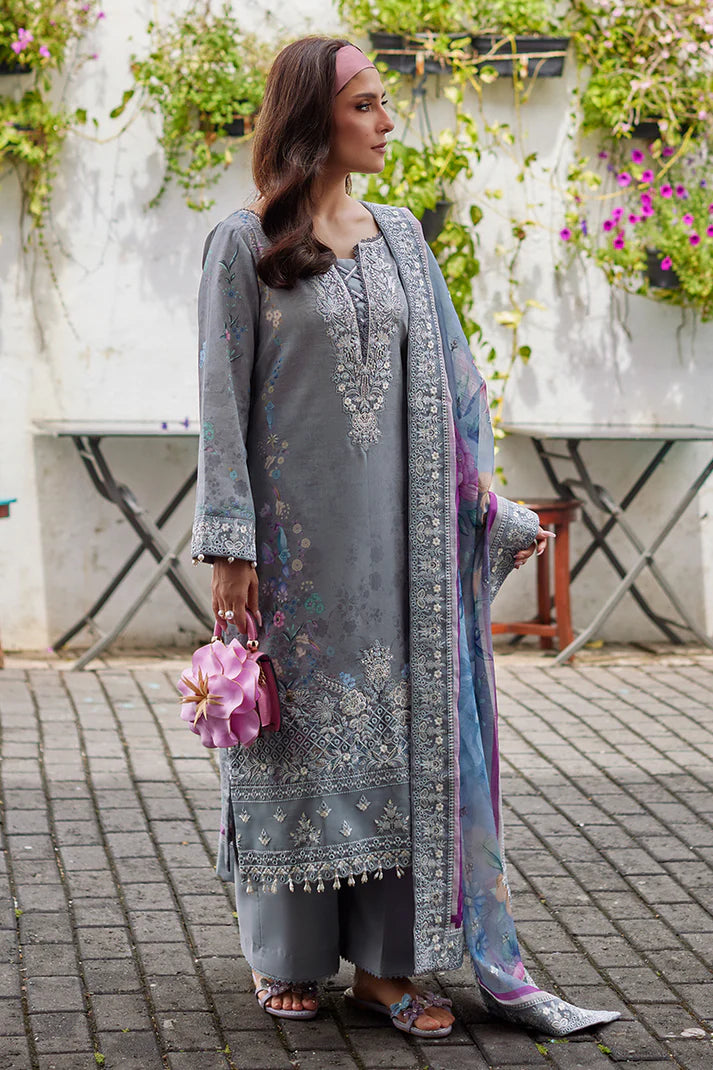 Model wearing Gulaal Saffira Lawn '25 Carla in soft grey with intricate floral embroidery and a gradient dupatta. Shop Pakistani luxury pret online in the UK.
