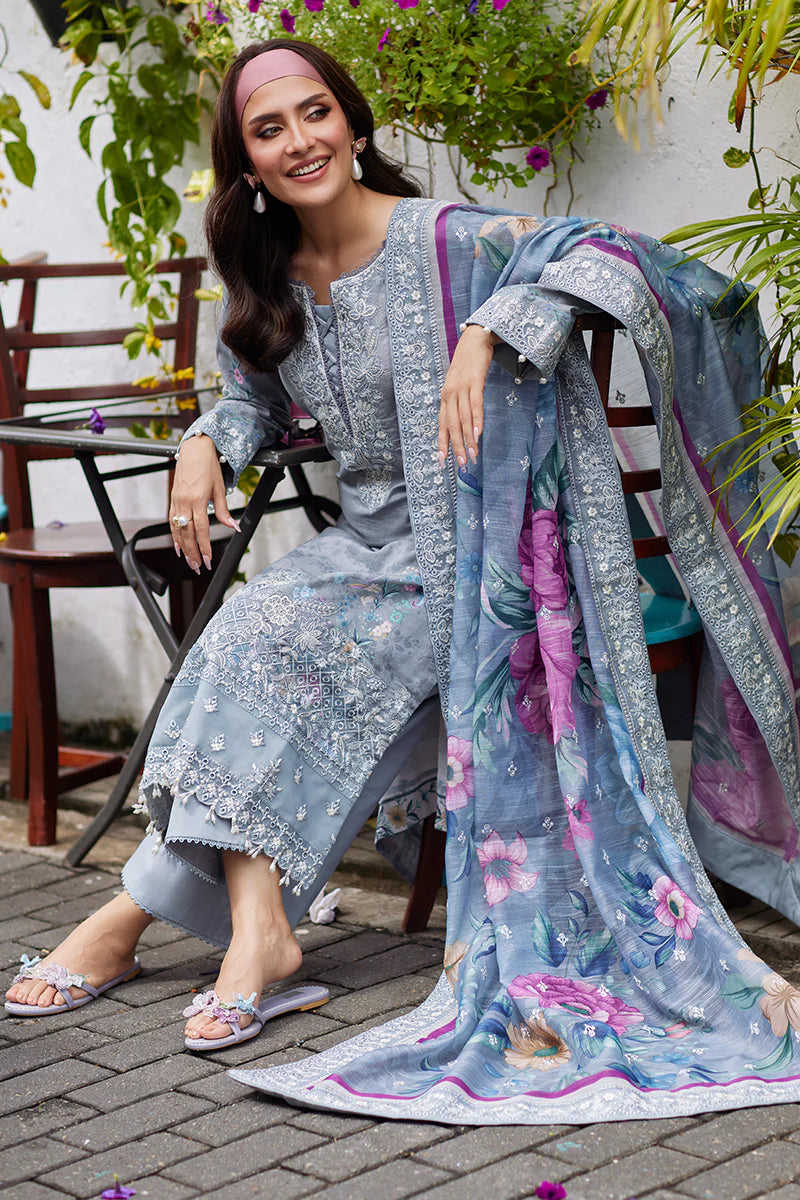 Model wearing Gulaal Saffira Lawn '25 Carla in soft grey with intricate floral embroidery and a gradient dupatta. Shop Pakistani luxury pret online in the UK.