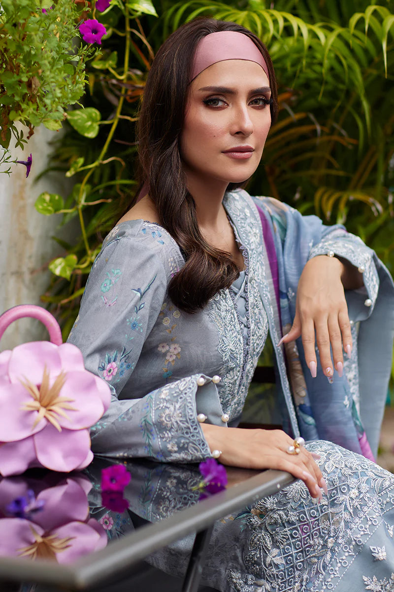 Model wearing Gulaal Saffira Lawn '25 Carla in soft grey with intricate floral embroidery and a gradient dupatta. Shop Pakistani luxury pret online in the UK.