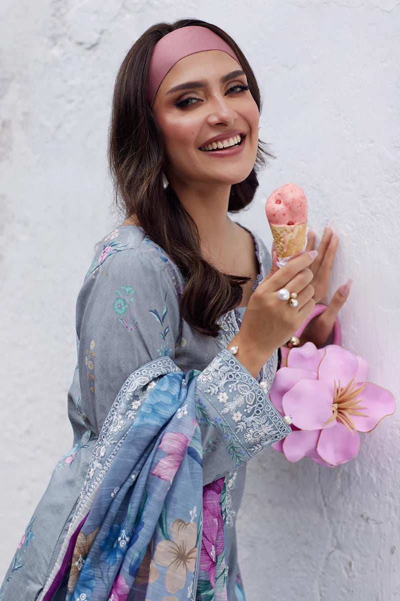 Model wearing Gulaal Saffira Lawn '25 Carla in soft grey with intricate floral embroidery and a gradient dupatta. Shop Pakistani luxury pret online in the UK.