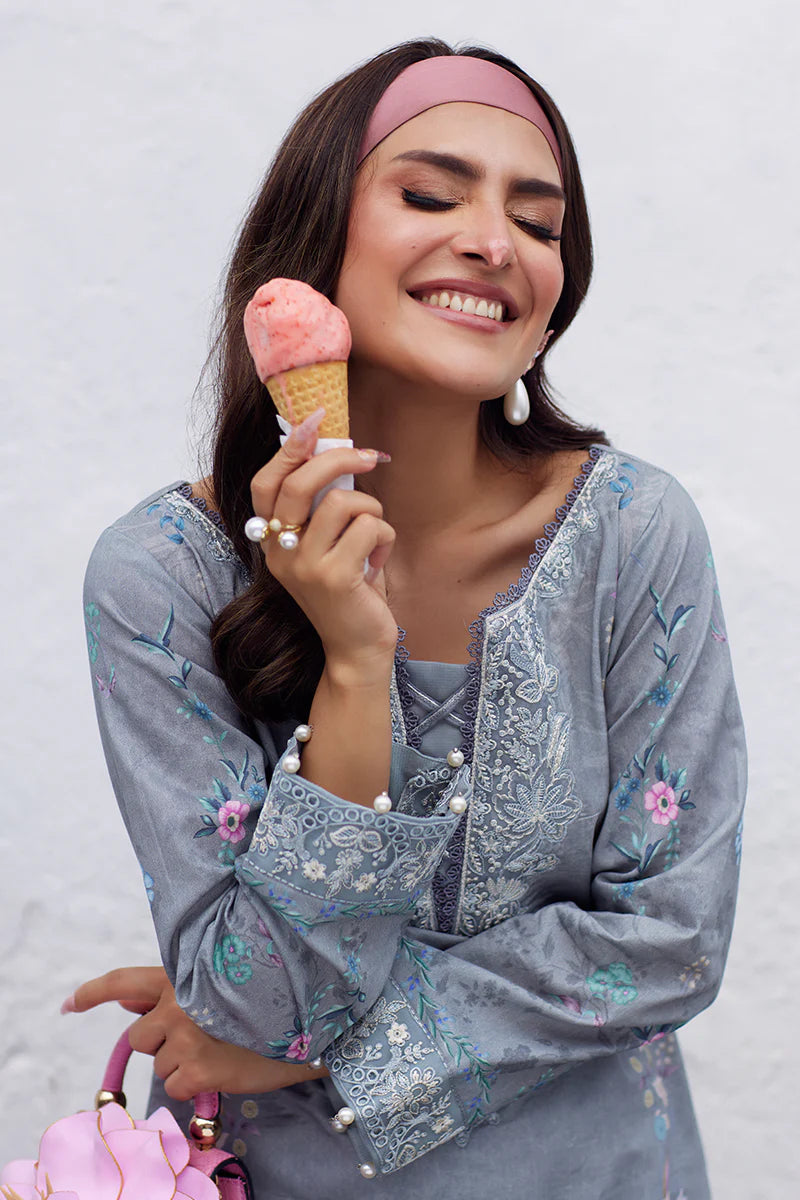 Model wearing Gulaal Saffira Lawn '25 Carla in soft grey with intricate floral embroidery and a gradient dupatta. Shop Pakistani luxury pret online in the UK.