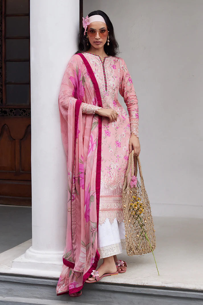 Model wearing Gulaal Saffira Lawn '25 Mila in soft pink with delicate embroidery and floral printed dupatta. Shop Pakistani luxury pret online in the UK.