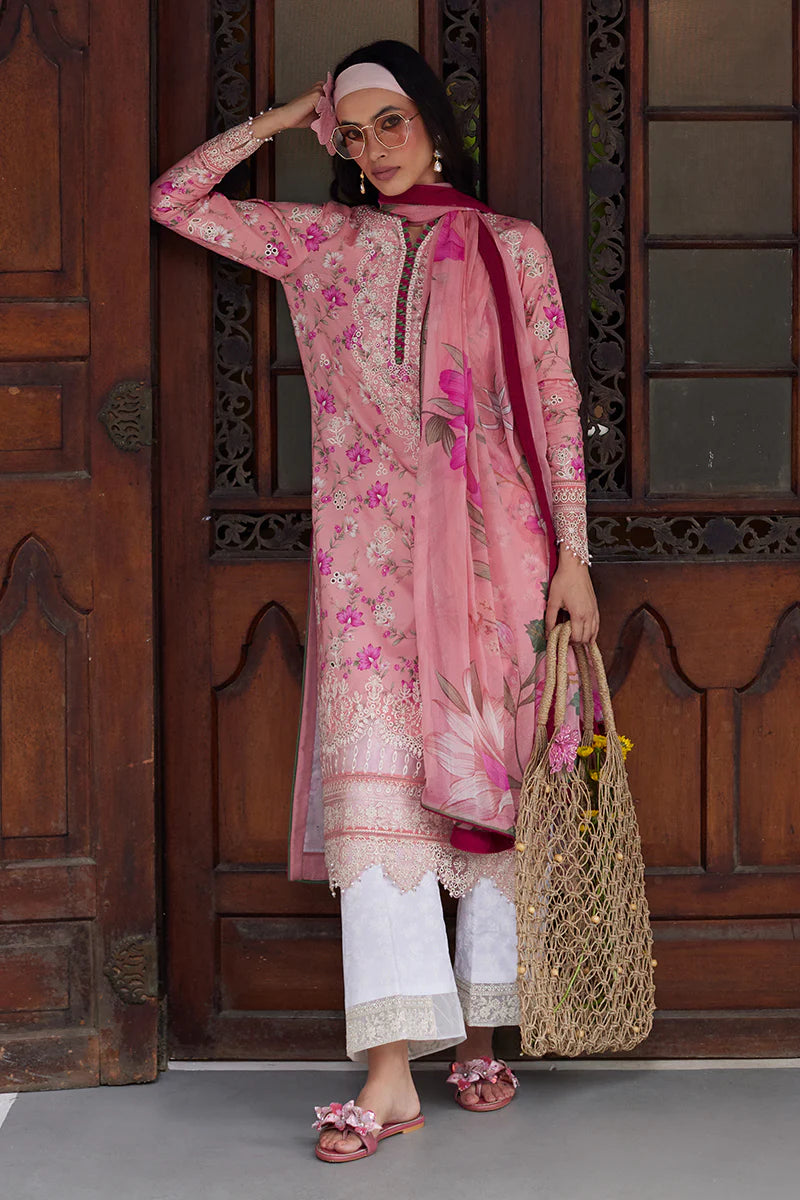 Model wearing Gulaal Saffira Lawn '25 Mila in soft pink with delicate embroidery and floral printed dupatta. Shop Pakistani luxury pret online in the UK.