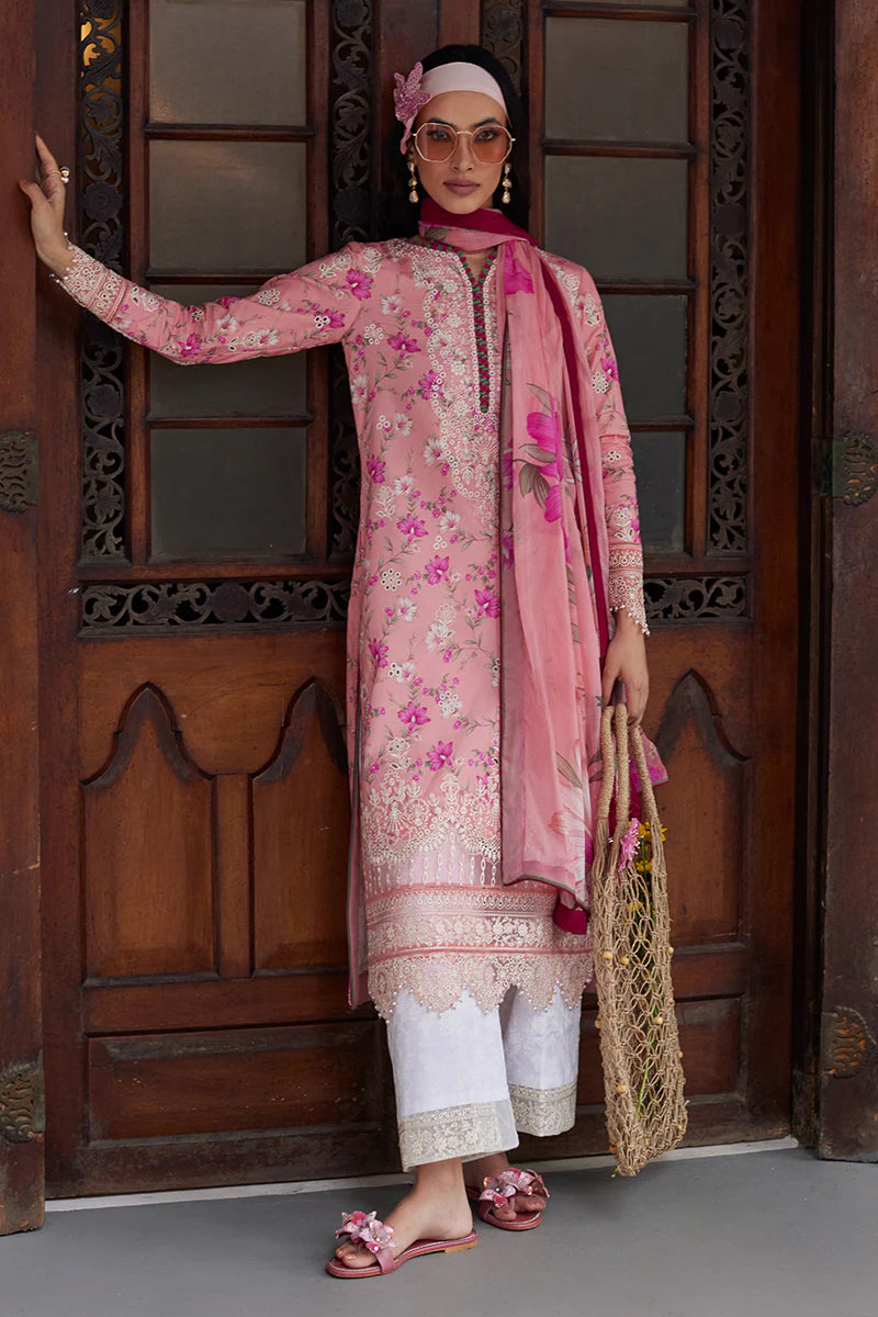 Model wearing Gulaal Saffira Lawn '25 Mila in soft pink with delicate embroidery and floral printed dupatta. Shop Pakistani luxury pret online in the UK.