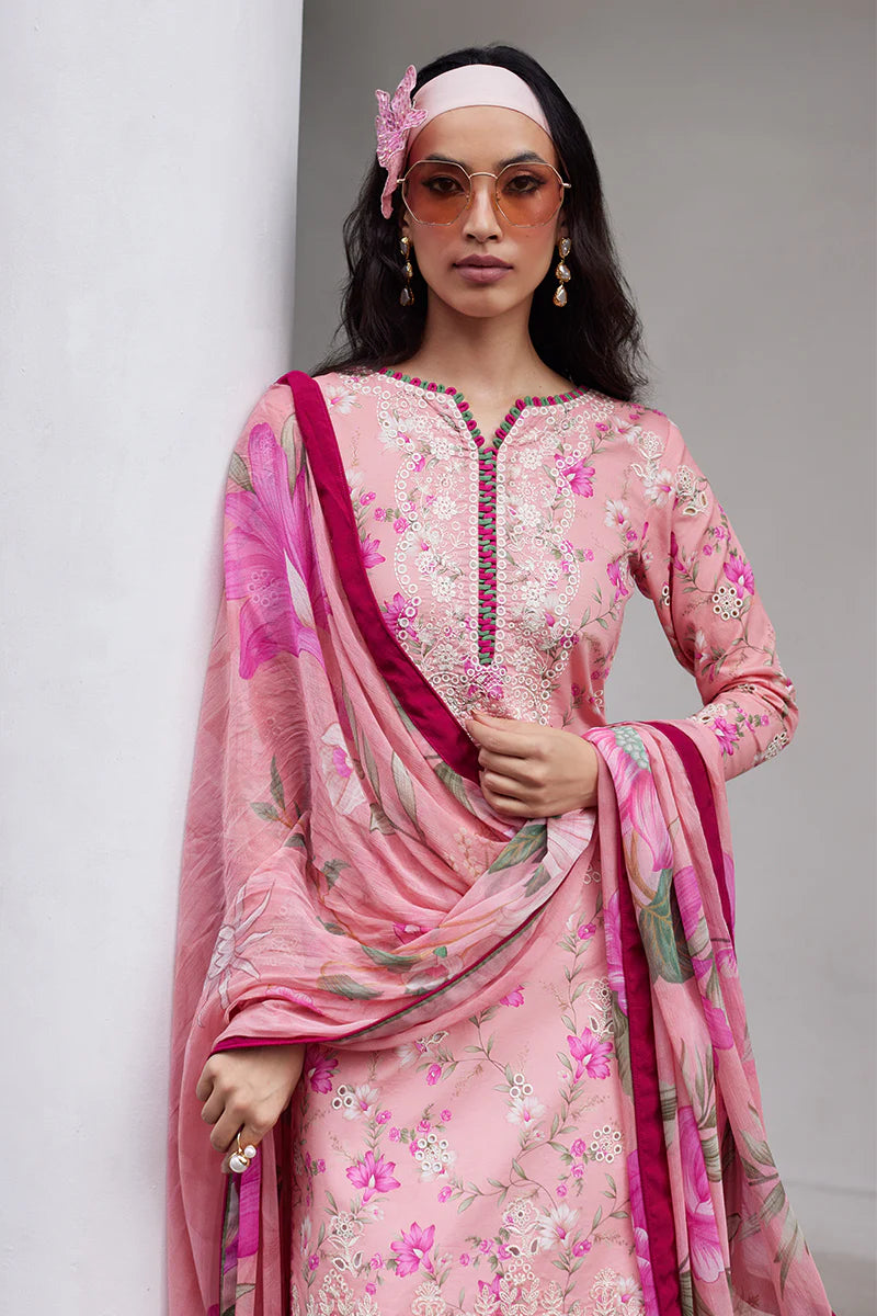 Model wearing Gulaal Saffira Lawn '25 Mila in soft pink with delicate embroidery and floral printed dupatta. Shop Pakistani luxury pret online in the UK.