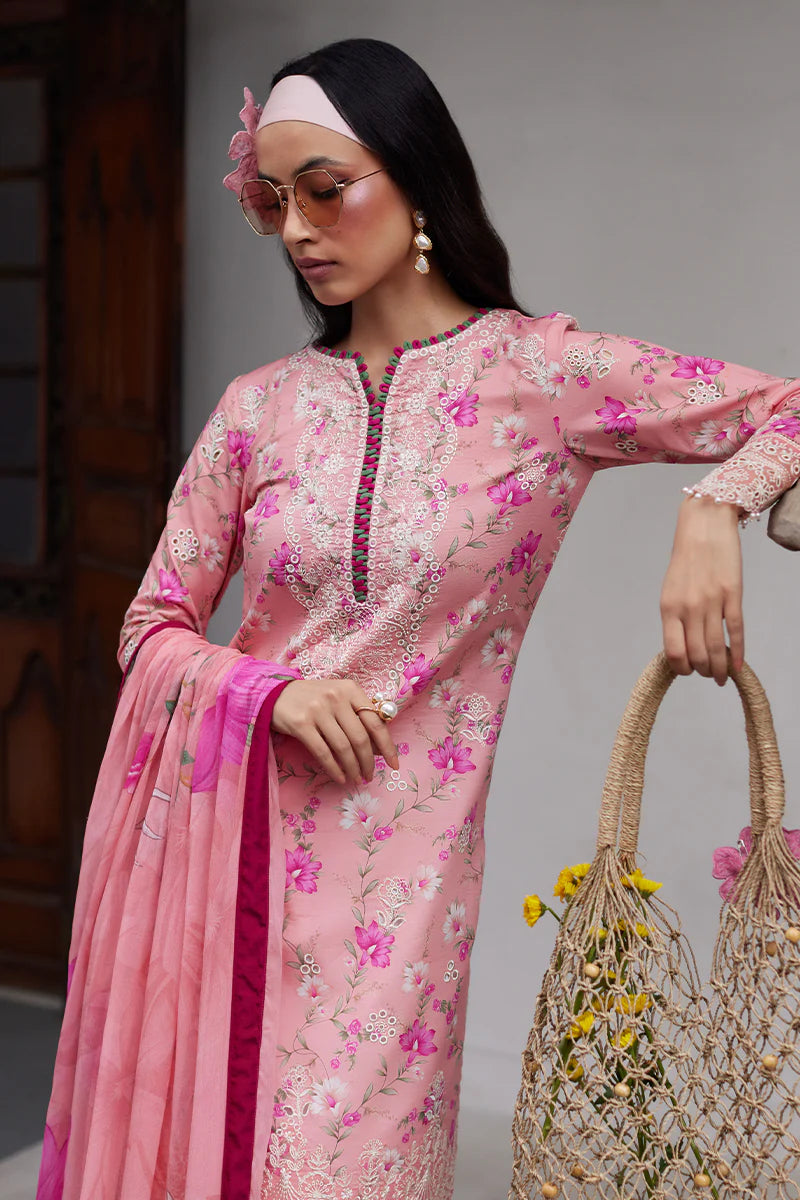 Model wearing Gulaal Saffira Lawn '25 Mila in soft pink with delicate embroidery and floral printed dupatta. Shop Pakistani luxury pret online in the UK.