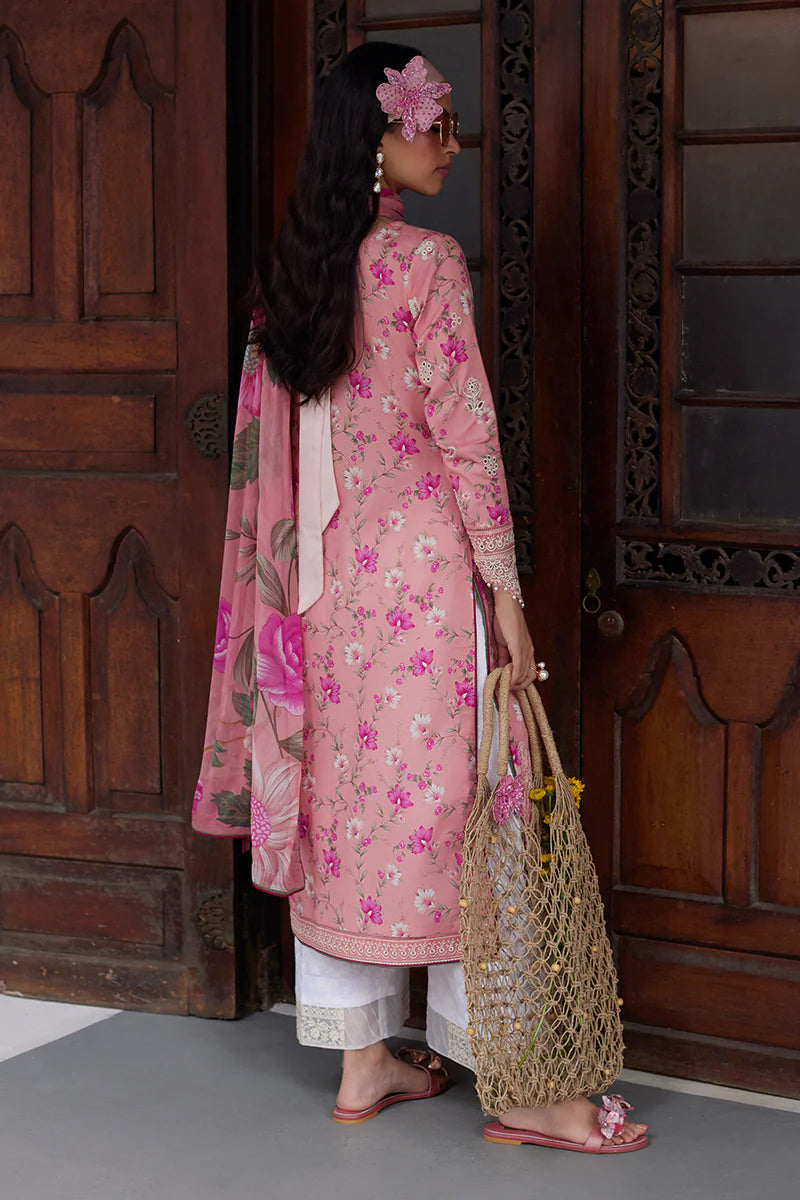 Model wearing Gulaal Saffira Lawn '25 Mila in soft pink with delicate embroidery and floral printed dupatta. Shop Pakistani luxury pret online in the UK.