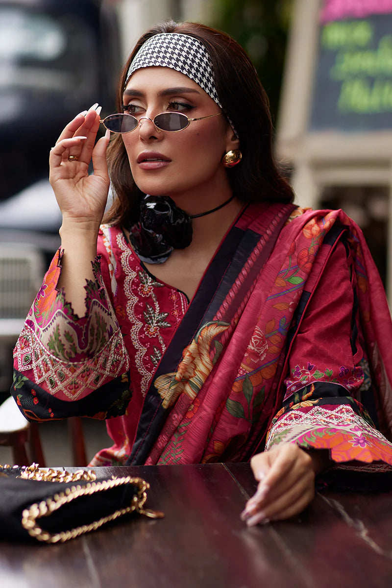 Model wearing Gulaal Saffira Lawn '25 Amelia in deep pink with intricate embroidery and printed dupatta. Shop Pakistani luxury pret online in the UK.