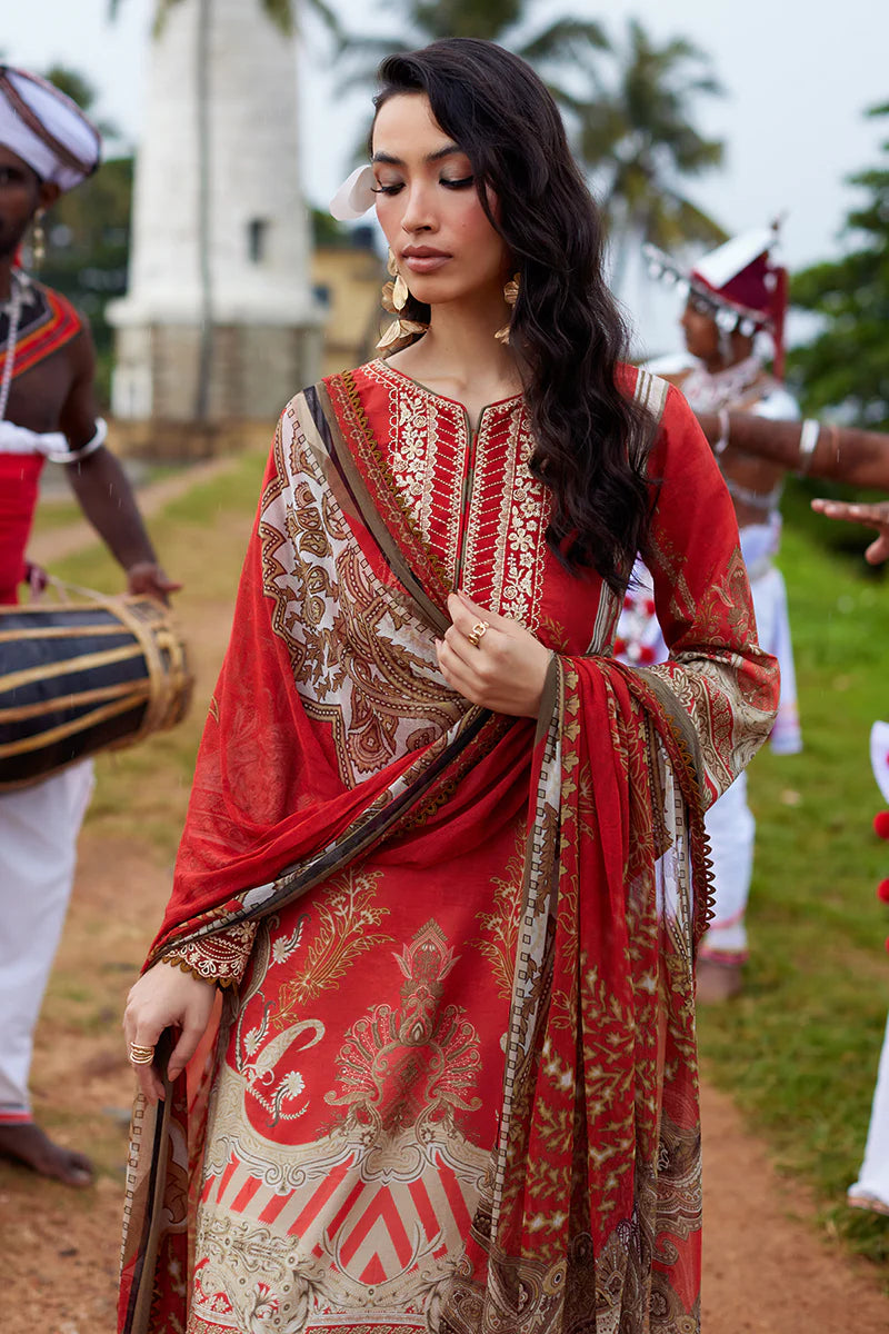 Model wearing Gulaal Saffira Lawn '25 Zhuri in red with intricate gold embroidery and printed dupatta. Shop Pakistani luxury pret online in the UK.