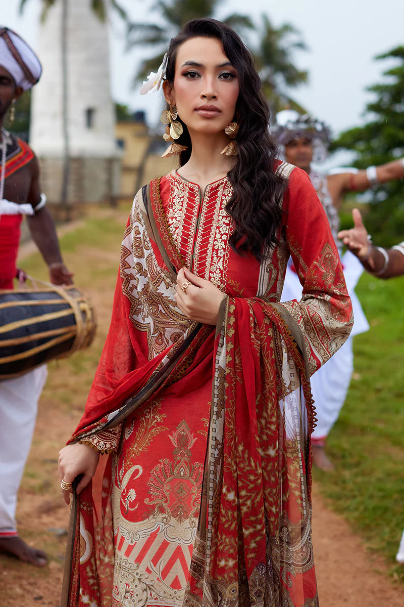 Model wearing Gulaal Saffira Lawn '25 Zhuri in red with intricate gold embroidery and printed dupatta. Shop Pakistani luxury pret online in the UK.