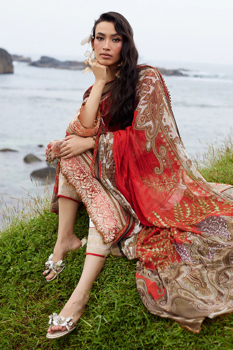 Model wearing Gulaal Saffira Lawn '25 Zhuri in red with intricate gold embroidery and printed dupatta. Shop Pakistani luxury pret online in the UK.