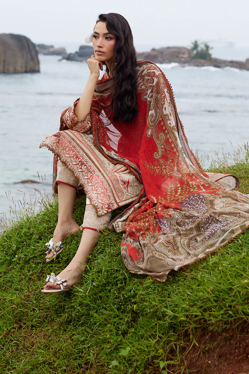 Model wearing Gulaal Saffira Lawn '25 Zhuri in red with intricate gold embroidery and printed dupatta. Shop Pakistani luxury pret online in the UK.