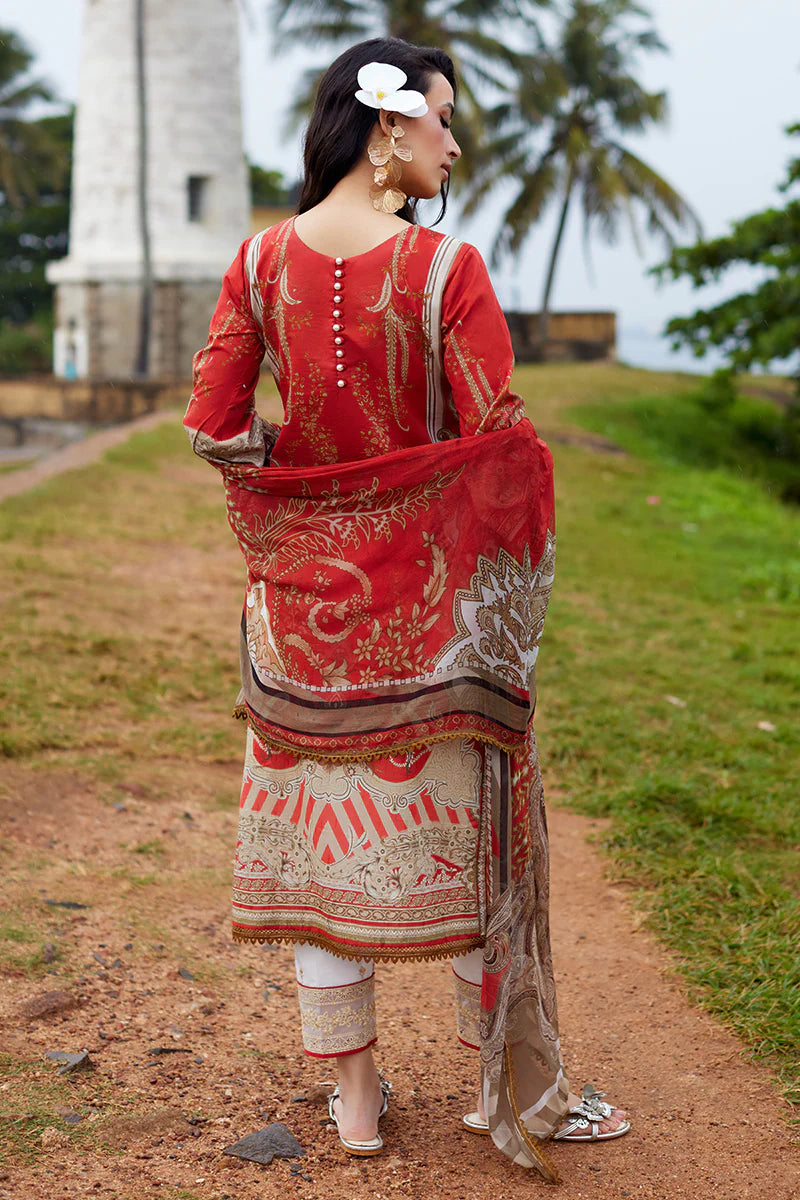 Model wearing Gulaal Saffira Lawn '25 Zhuri in red with intricate gold embroidery and printed dupatta. Shop Pakistani luxury pret online in the UK.