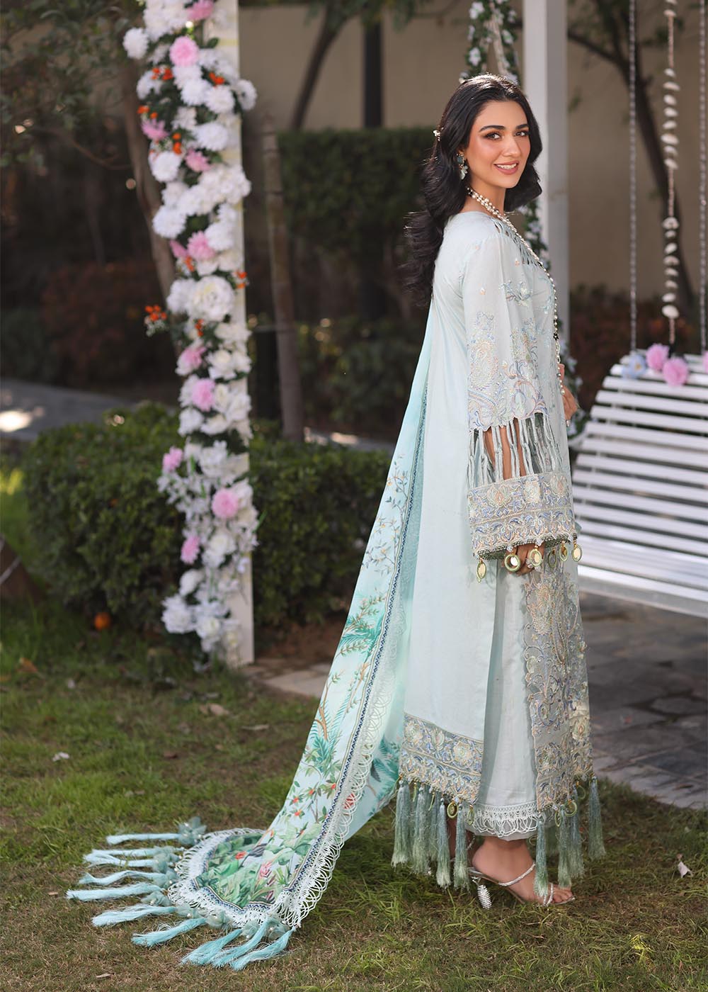 Model wearing pastel blue embroidered dress with tassel detailing from Musferah Saad's Selene, Pakistani luxury pret available online in UK.