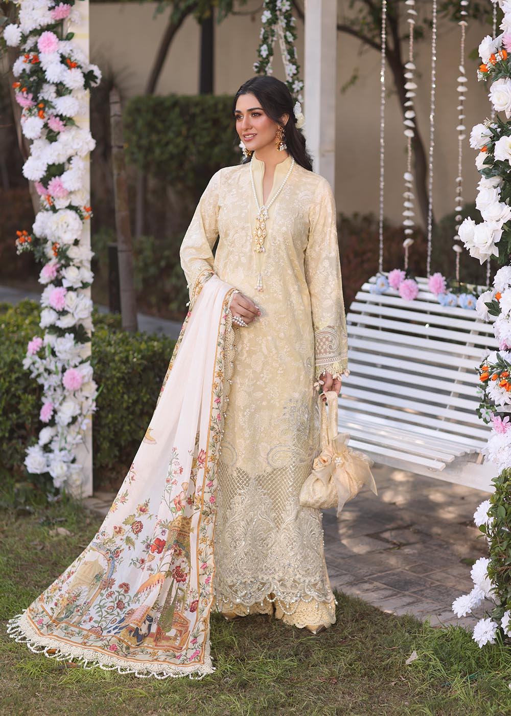 Model wearing beige embroidered dress with printed white dupatta from Musferah Saad Sunshine, Pakistani luxury pret online in UK.