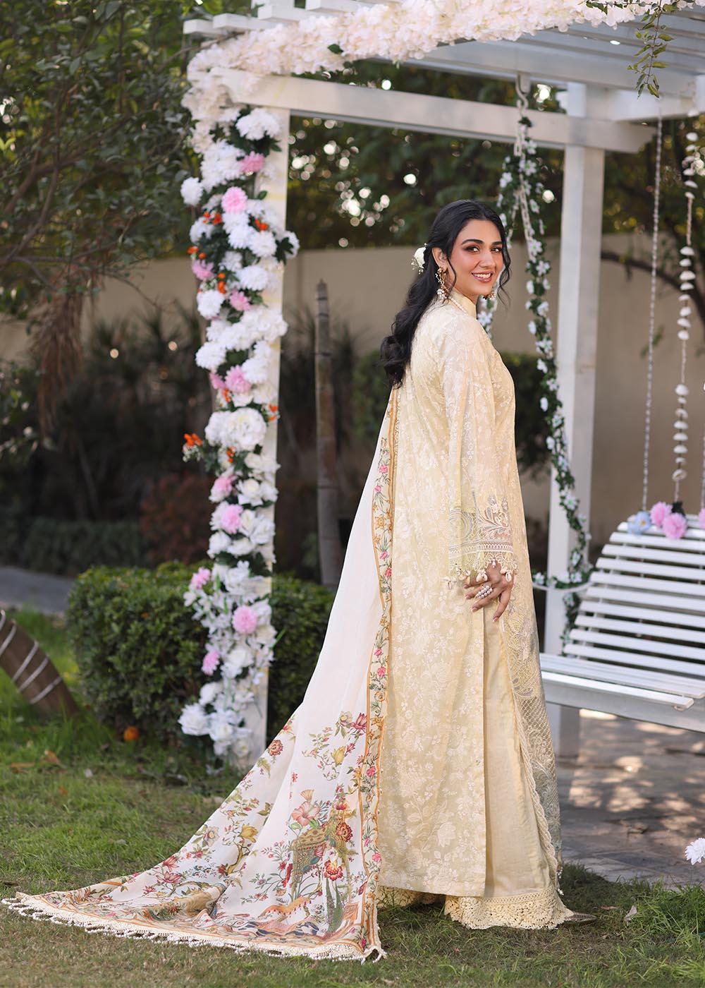 Model wearing beige embroidered dress with printed white dupatta from Musferah Saad Sunshine, Pakistani luxury pret online in UK.