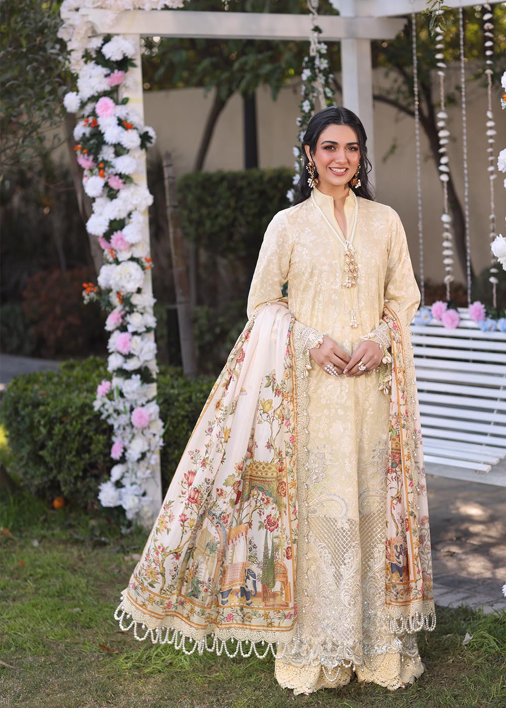 Model wearing beige embroidered dress with printed white dupatta from Musferah Saad Sunshine, Pakistani luxury pret online in UK.
