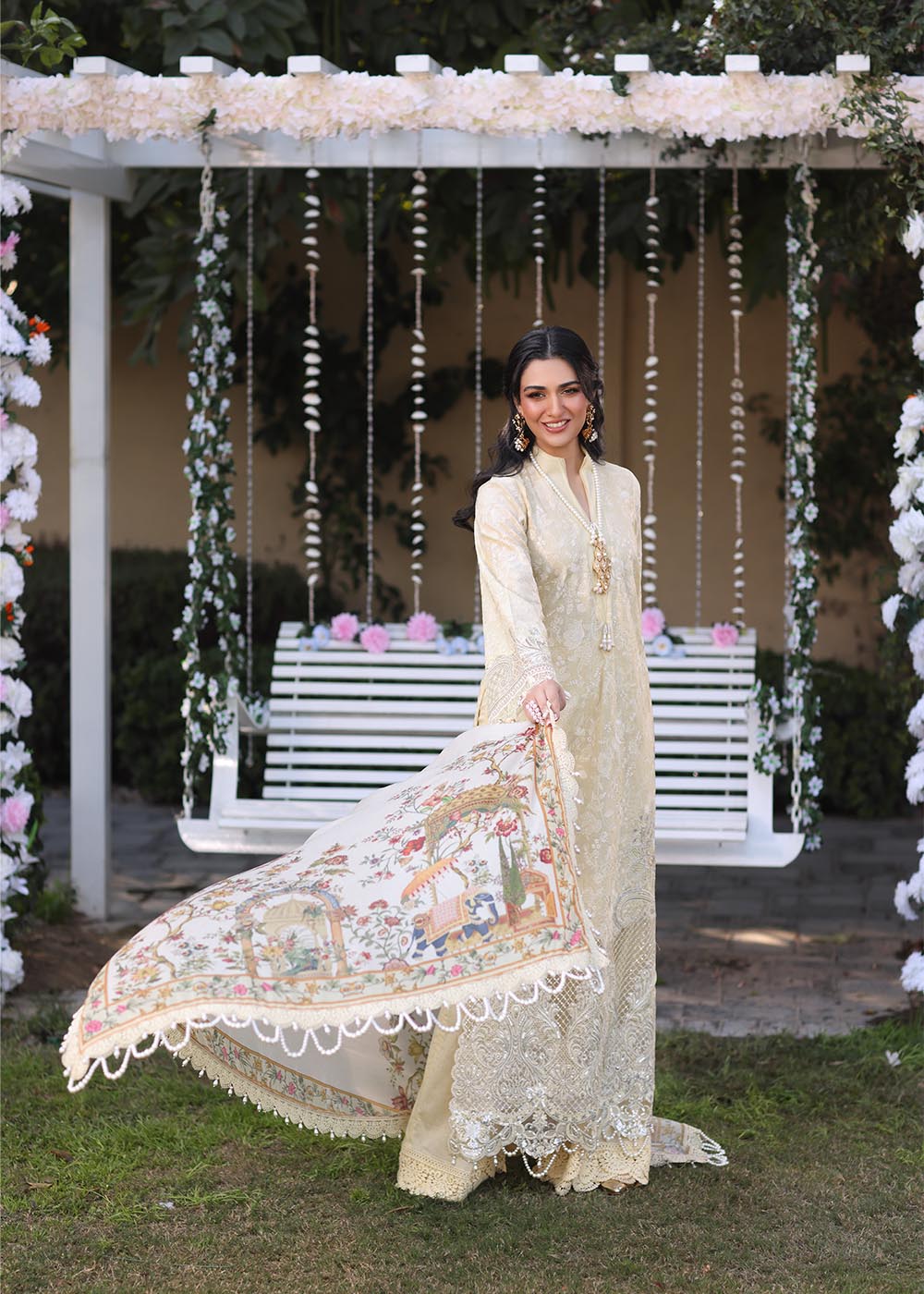 Model wearing beige embroidered dress with printed white dupatta from Musferah Saad Sunshine, Pakistani luxury pret online in UK.