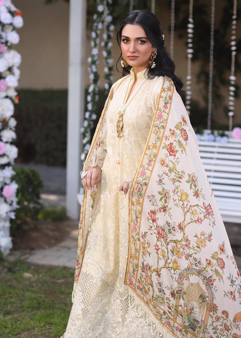 Model wearing beige embroidered dress with printed white dupatta from Musferah Saad Sunshine, Pakistani luxury pret online in UK.