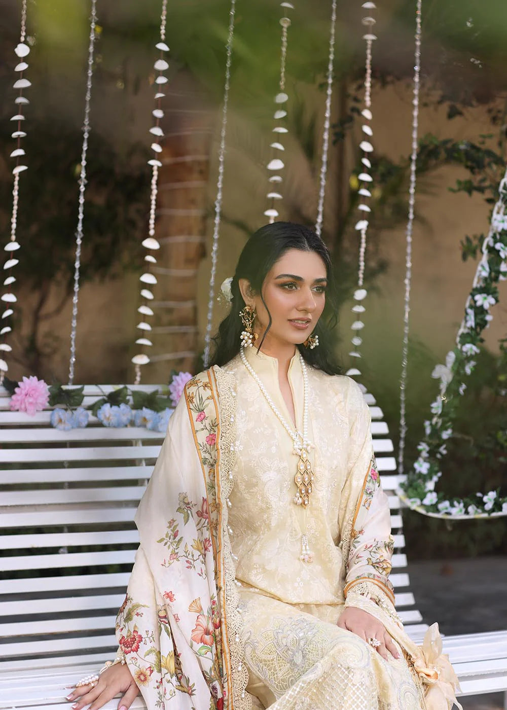 Model wearing beige embroidered dress with printed white dupatta from Musferah Saad Sunshine, Pakistani luxury pret online in UK.