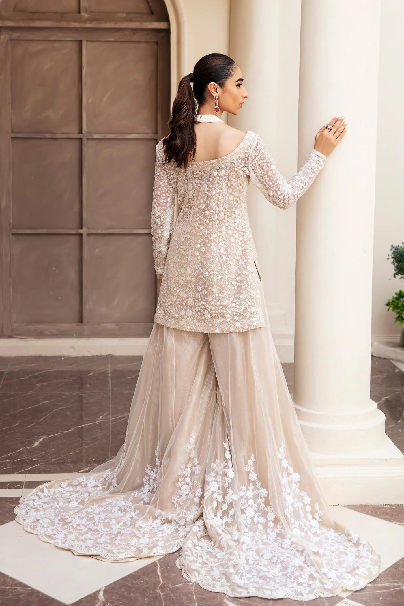 Model wearing Symphony's RADIANT PEARL, an equisite mold by Musferah Saad UK, Pakistani Clothes UK.