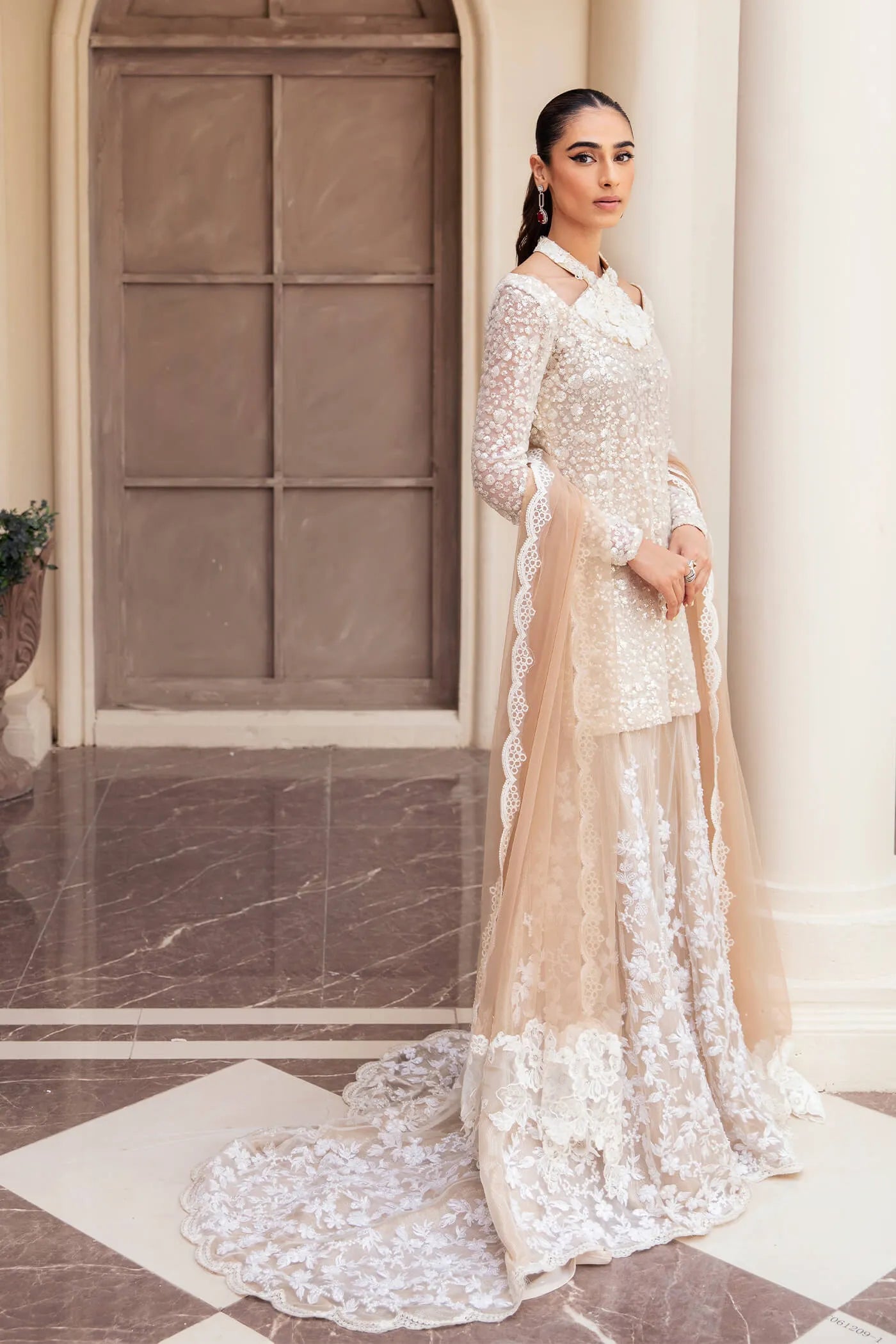 Model wearing Symphony's RADIANT PEARL, an equisite mold by Musferah Saad UK, Pakistani Clothes UK.