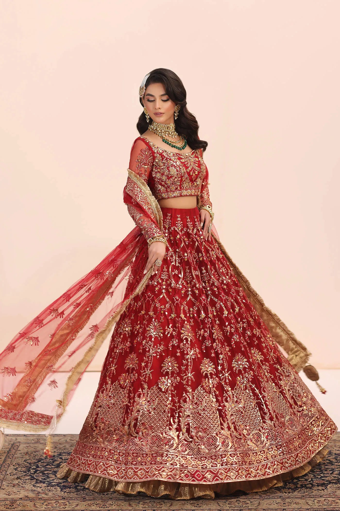 Model in Musferah Saad Crimson Jewel red Pakistani wedding dress, UK.