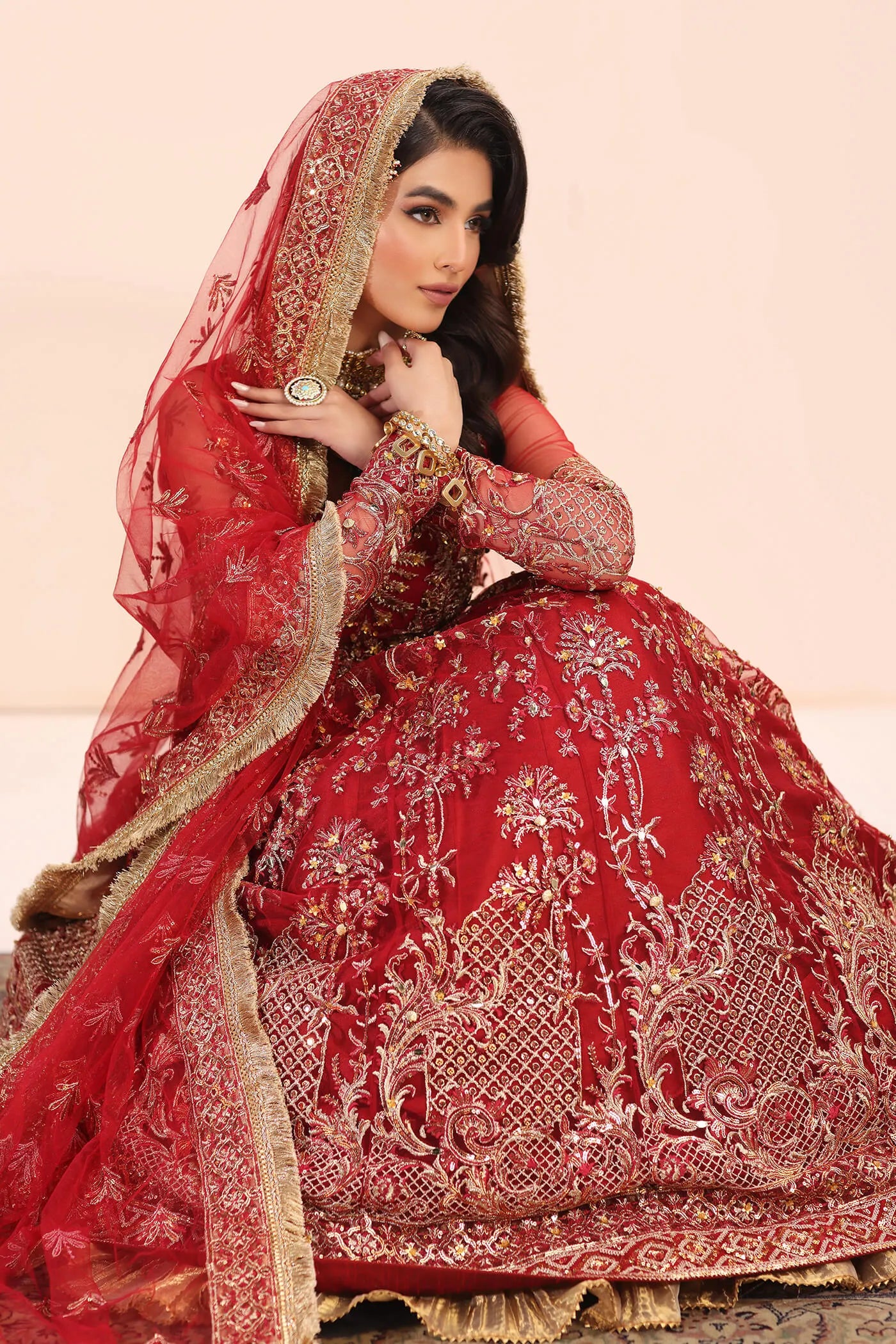 Model in Musferah Saad Crimson Jewel red Pakistani wedding dress, UK.