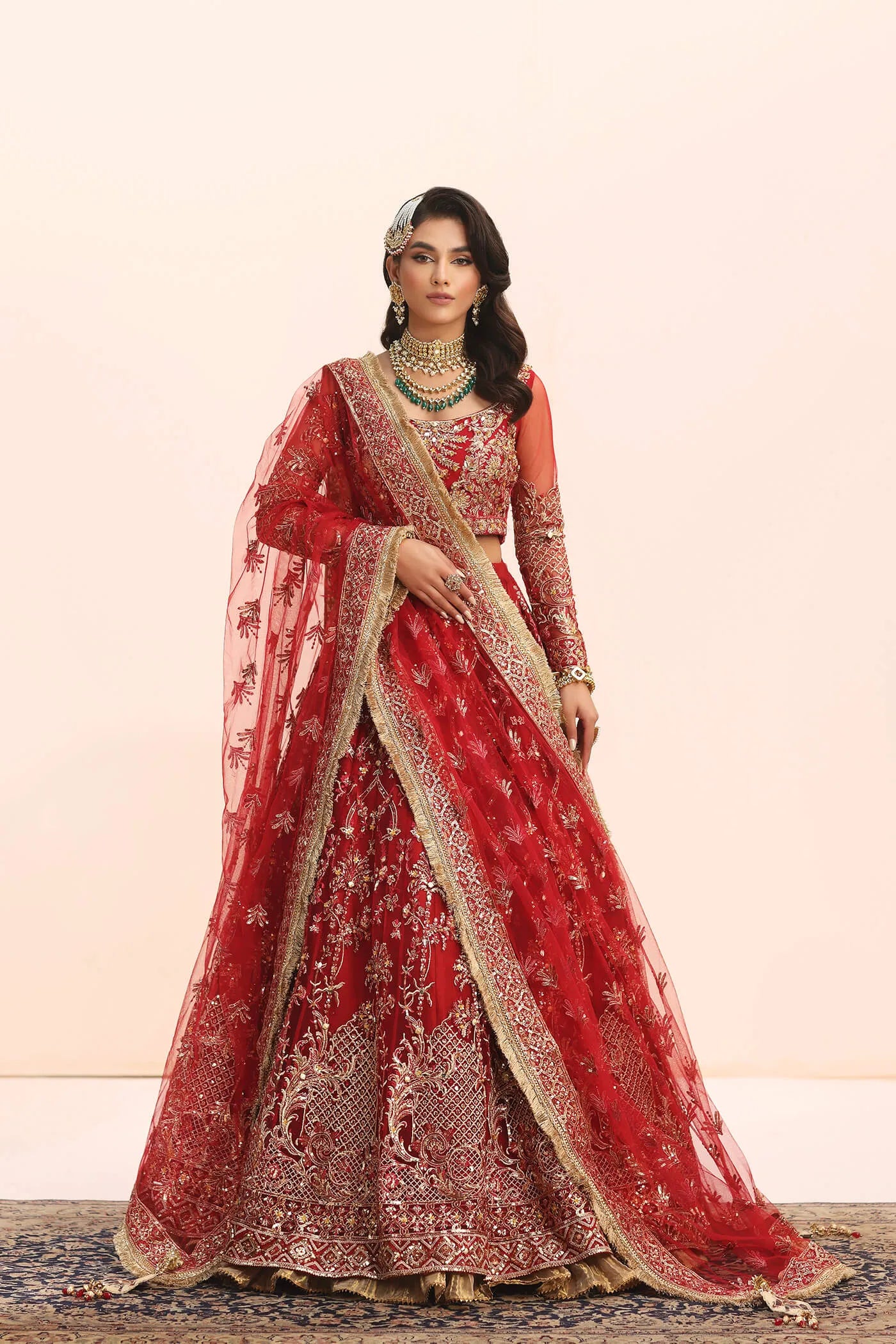 Model in Musferah Saad Crimson Jewel red Pakistani wedding dress, UK.