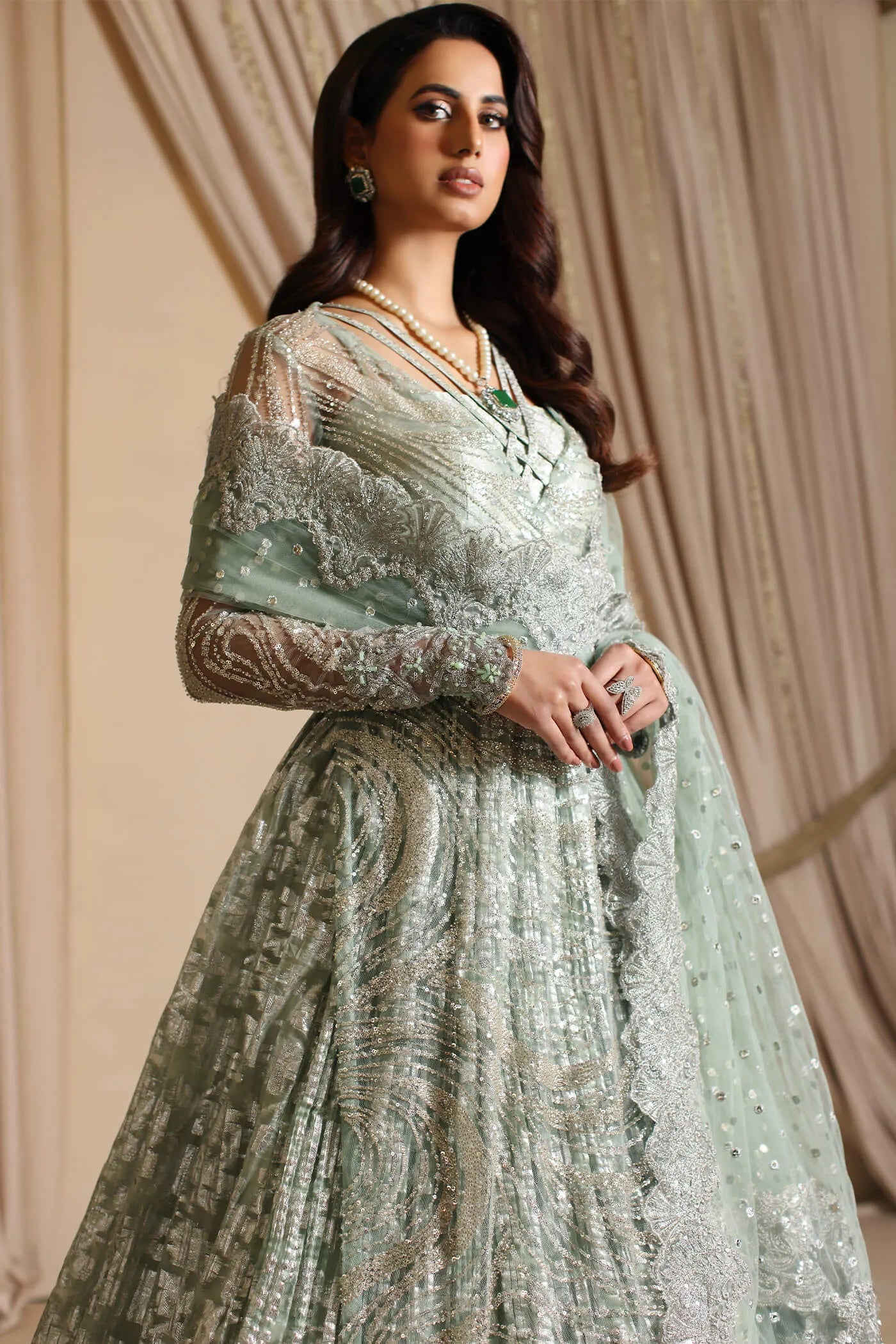 Model wearing Musferah Saad Aqua Grandeur, an exquisite Pakistani bridal dress in UK.