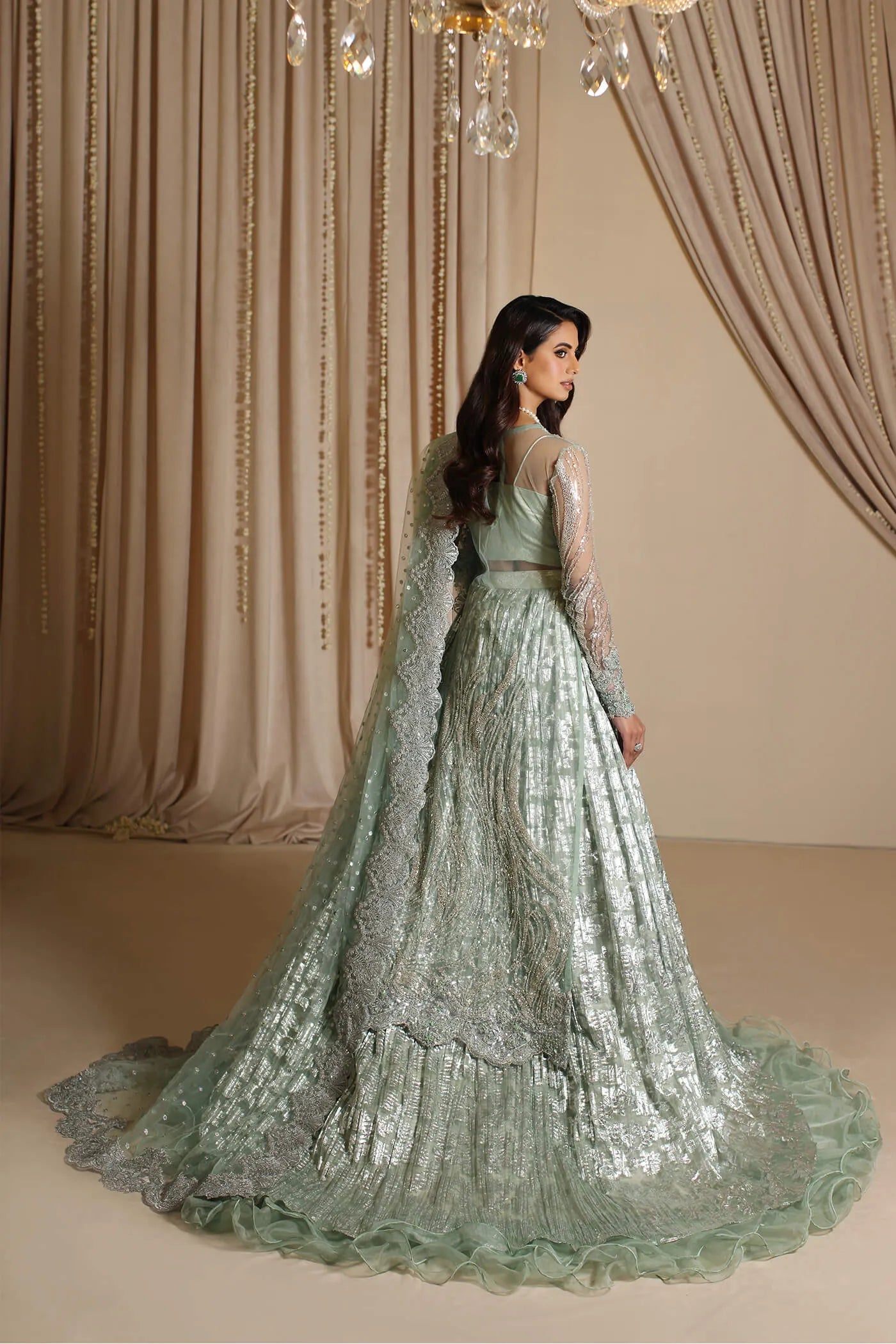 Model wearing Musferah Saad Aqua Grandeur, an exquisite Pakistani bridal dress in UK.
