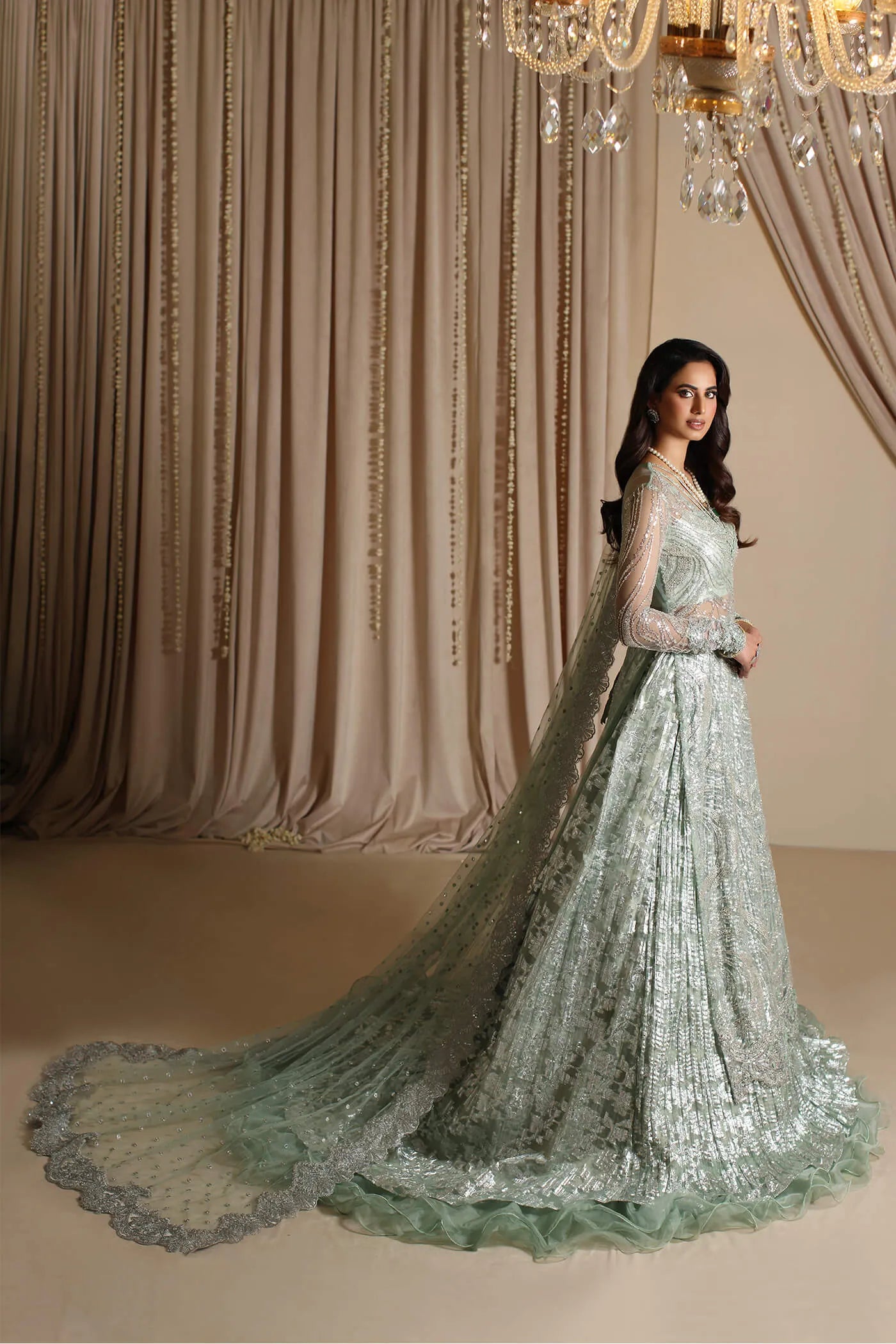 Model wearing Musferah Saad Aqua Grandeur, an exquisite Pakistani bridal dress in UK.