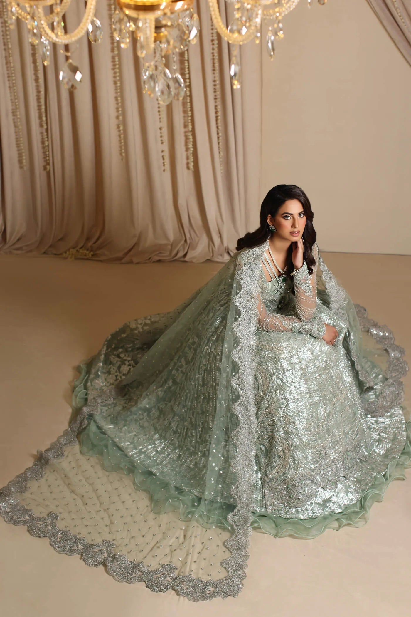 Model wearing Musferah Saad Aqua Grandeur, an exquisite Pakistani bridal dress in UK.