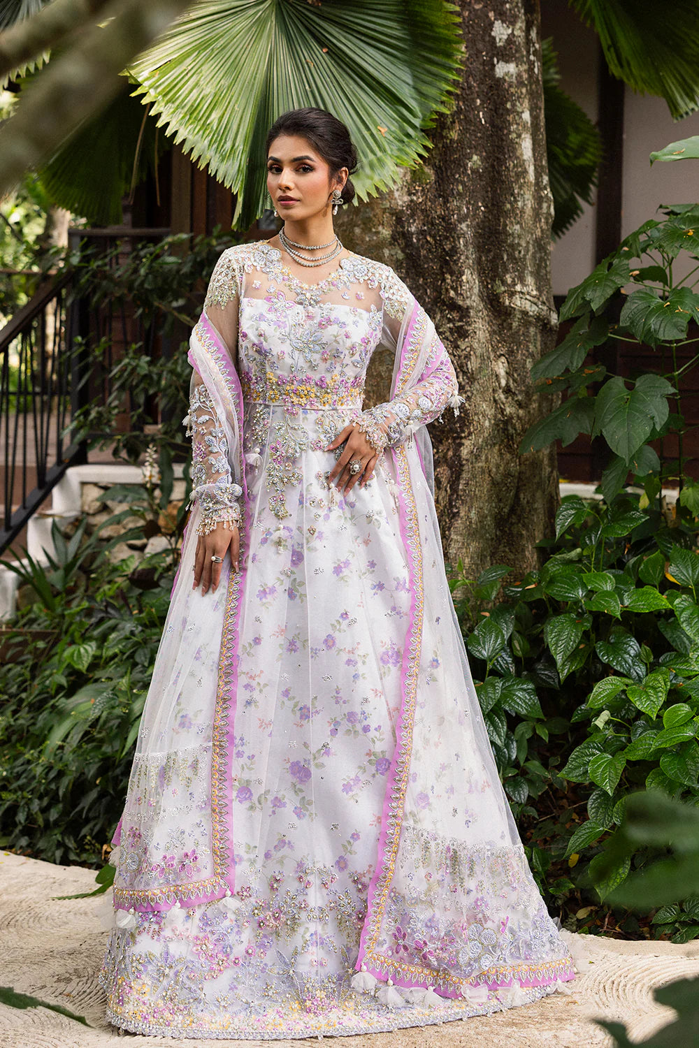 Model wearing Saira Rizwan ELINA-SRF25-05 in white and lilac floral embroidery – Pakistani luxury pret, shop online in UK.