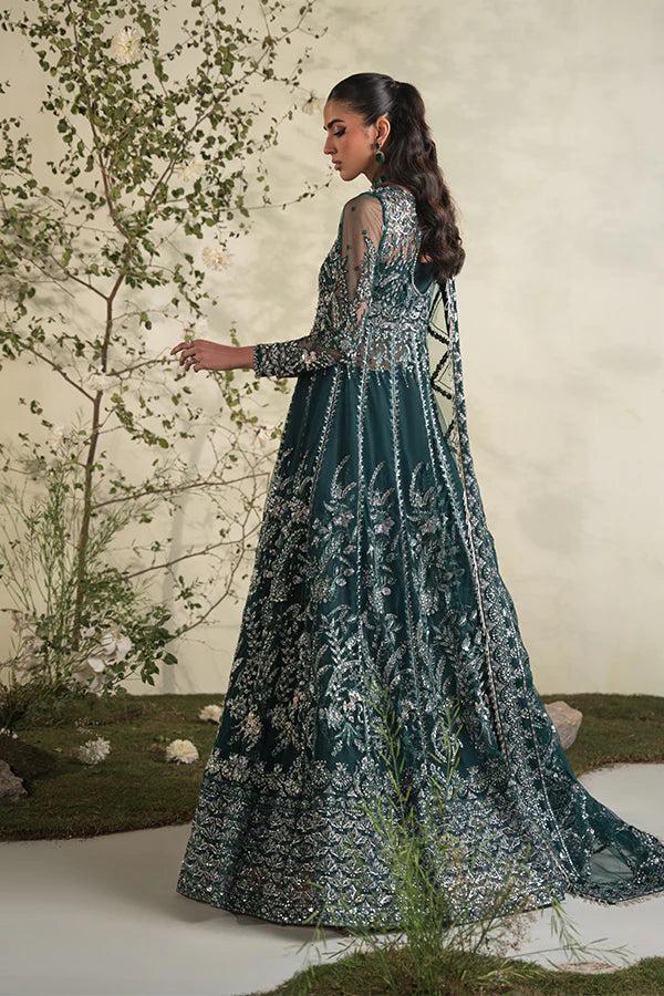 Model in Saffron Mehri, sparkling Pakistani festive dress in UK.