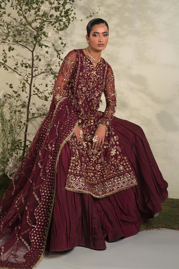 Model in Saffron Rosette, rich Pakistani dress, UK festive collection.