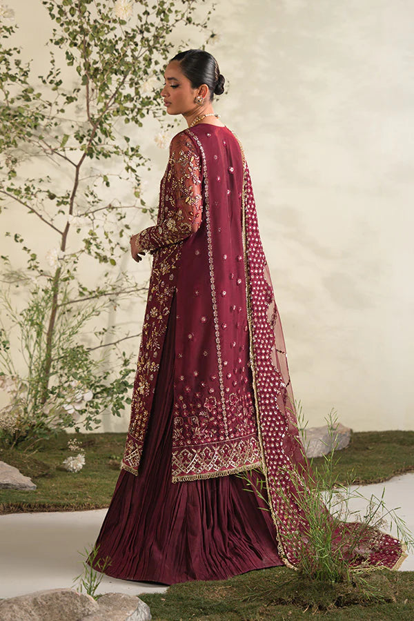 Model in Saffron Rosette, rich Pakistani dress, UK festive collection.