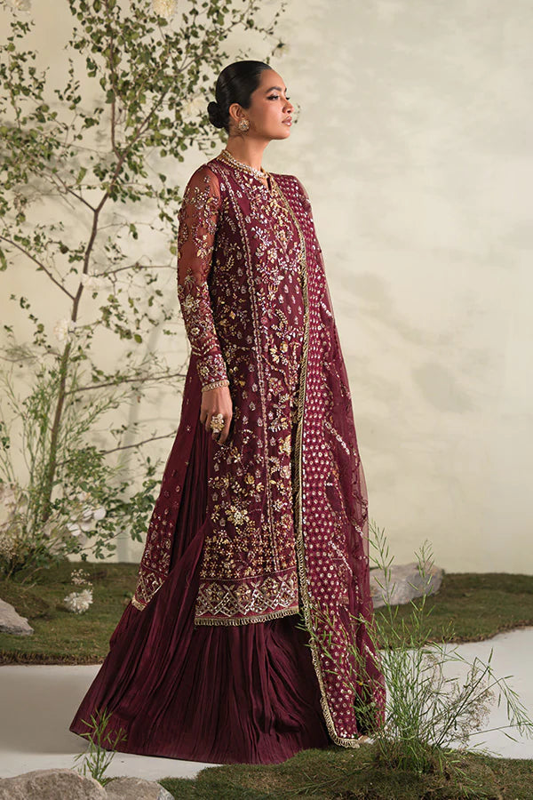 Model in Saffron Rosette, rich Pakistani dress, UK festive collection.