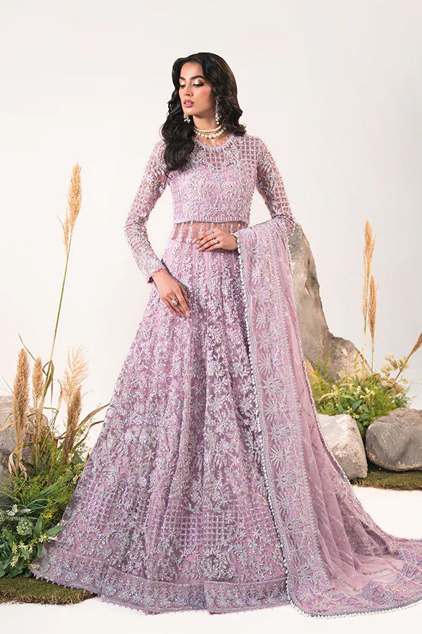 Model dons Saffron Mahroo, opulent Pakistani UK festive attire.