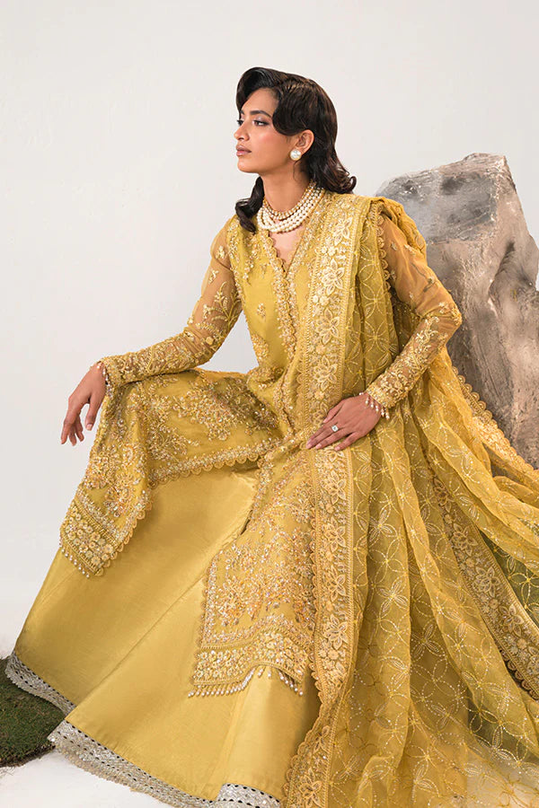 Model in Saffron Elmira, Pakistani festive dress, UK exclusive.