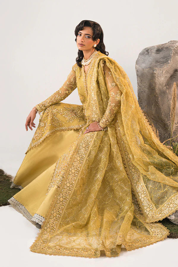 Model in Saffron Elmira, Pakistani festive dress, UK exclusive.
