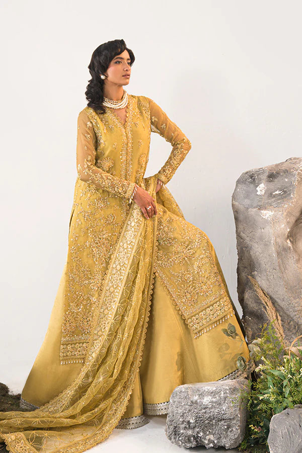 Model in Saffron Elmira, Pakistani festive dress, UK exclusive.