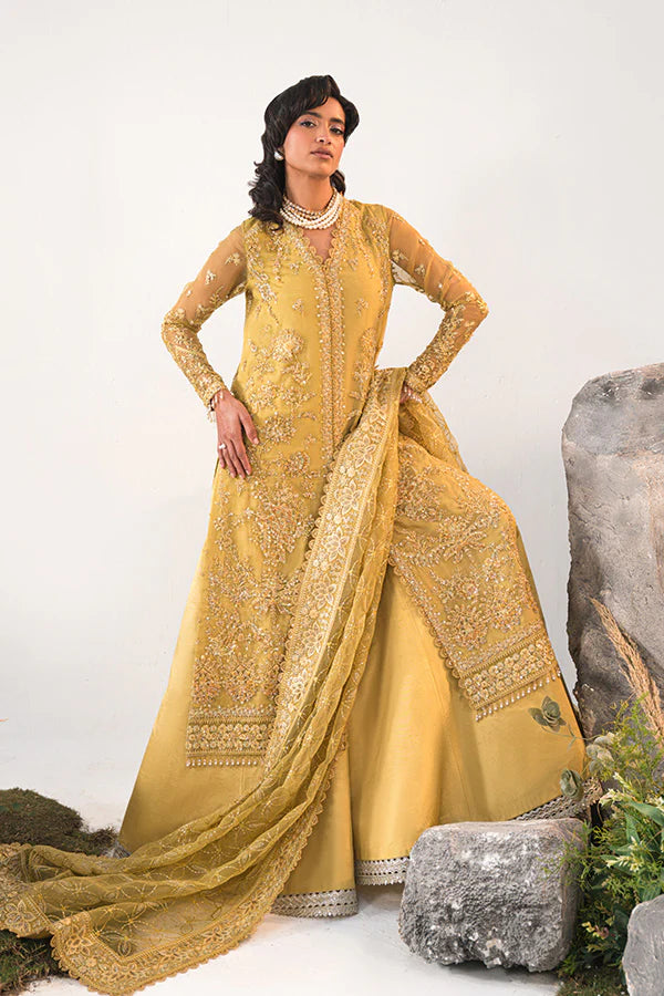 Model in Saffron Elmira, Pakistani festive dress, UK exclusive.