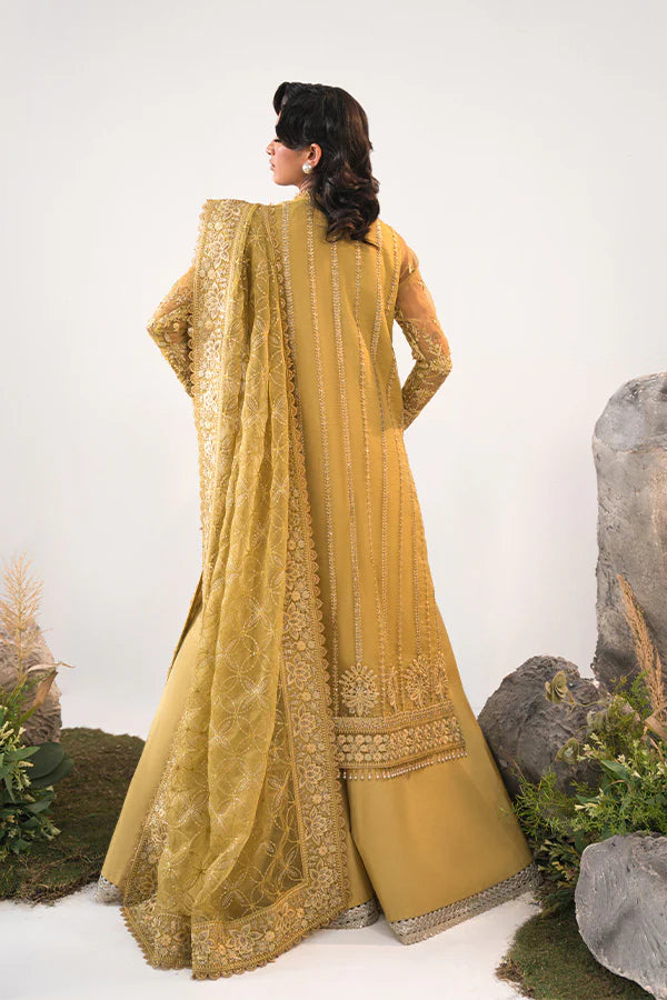 Model in Saffron Elmira, Pakistani festive dress, UK exclusive.
